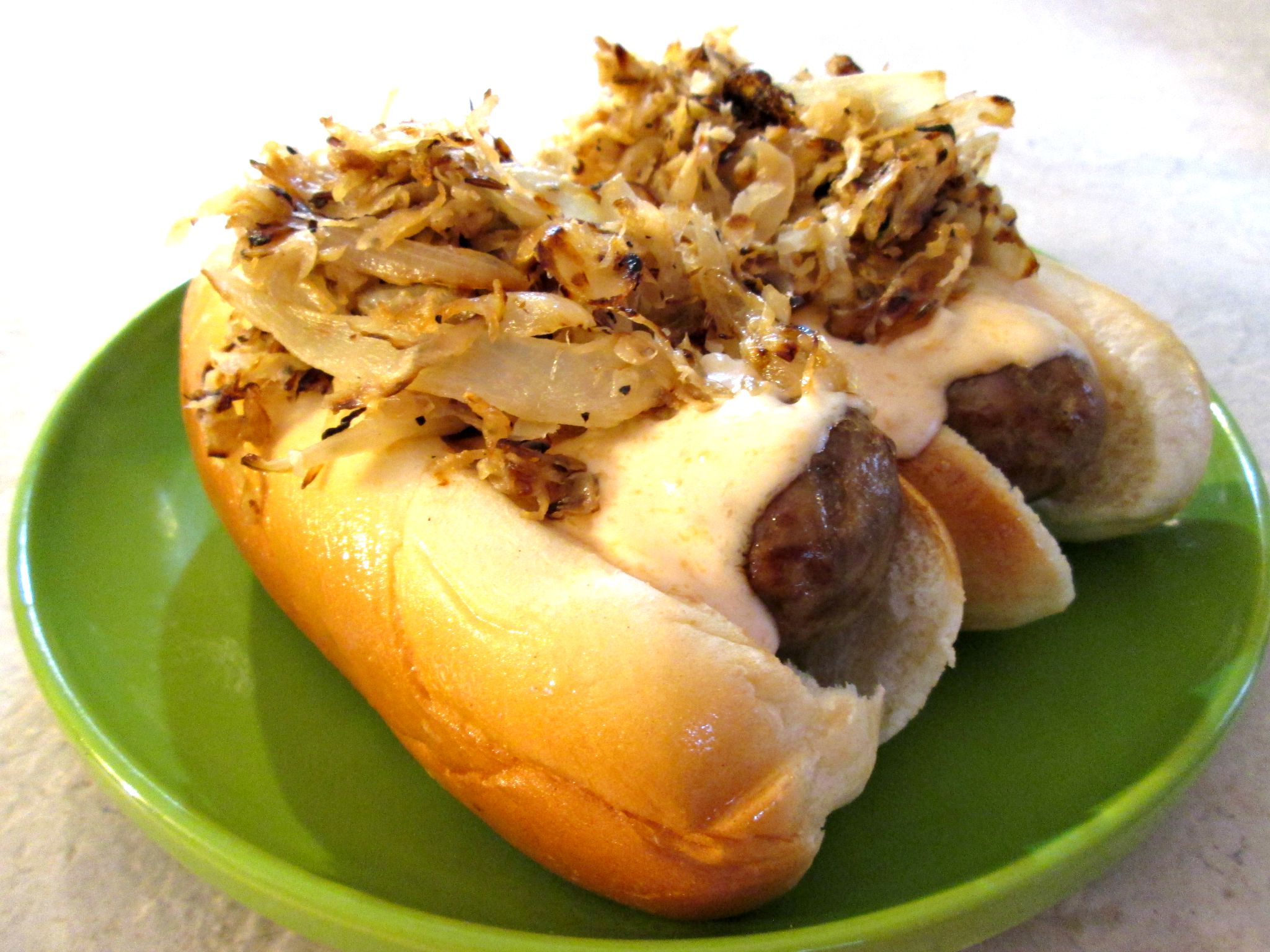 Beer Bratwurst with Sauerkraut and Cheese Sauce