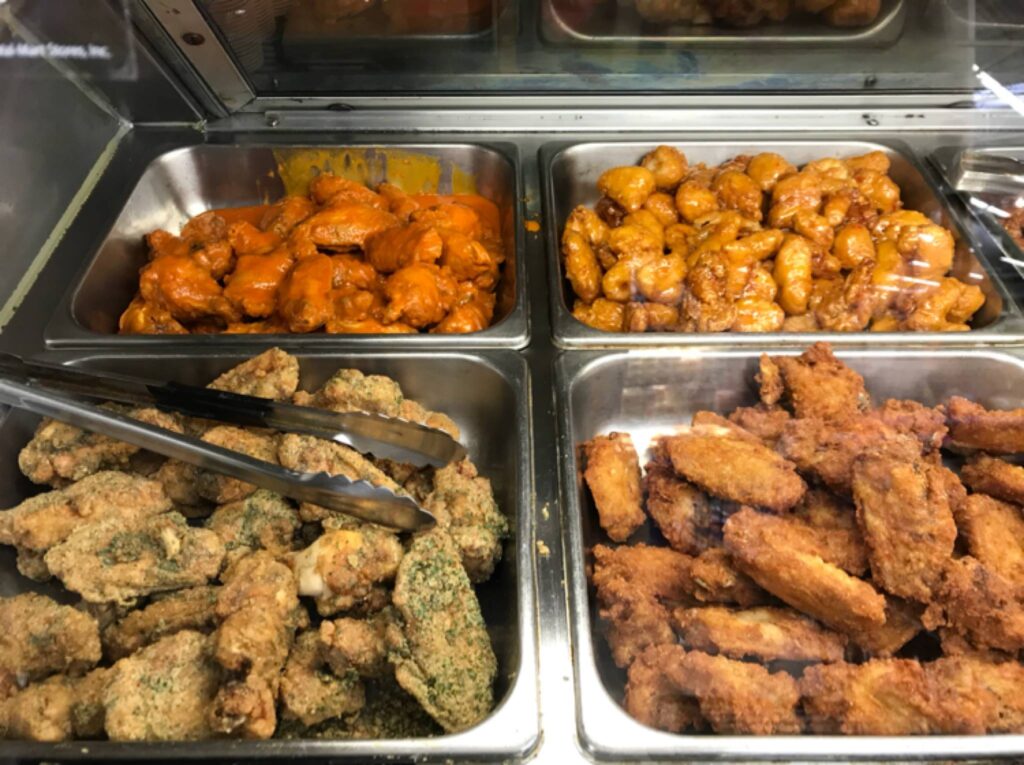 A variety of chicken wings served in Walmart's Deli Hot Case.