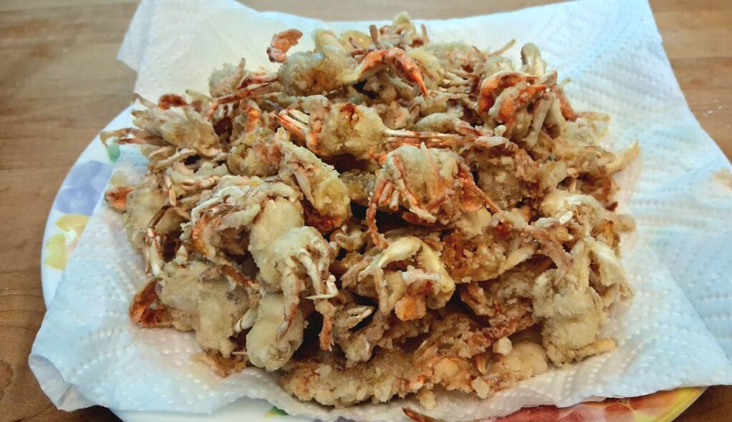 close-up of golden brown fried soft-shell crabs