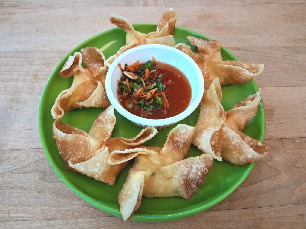 Crispy fried Crab Rangoon served with dipping sauce.