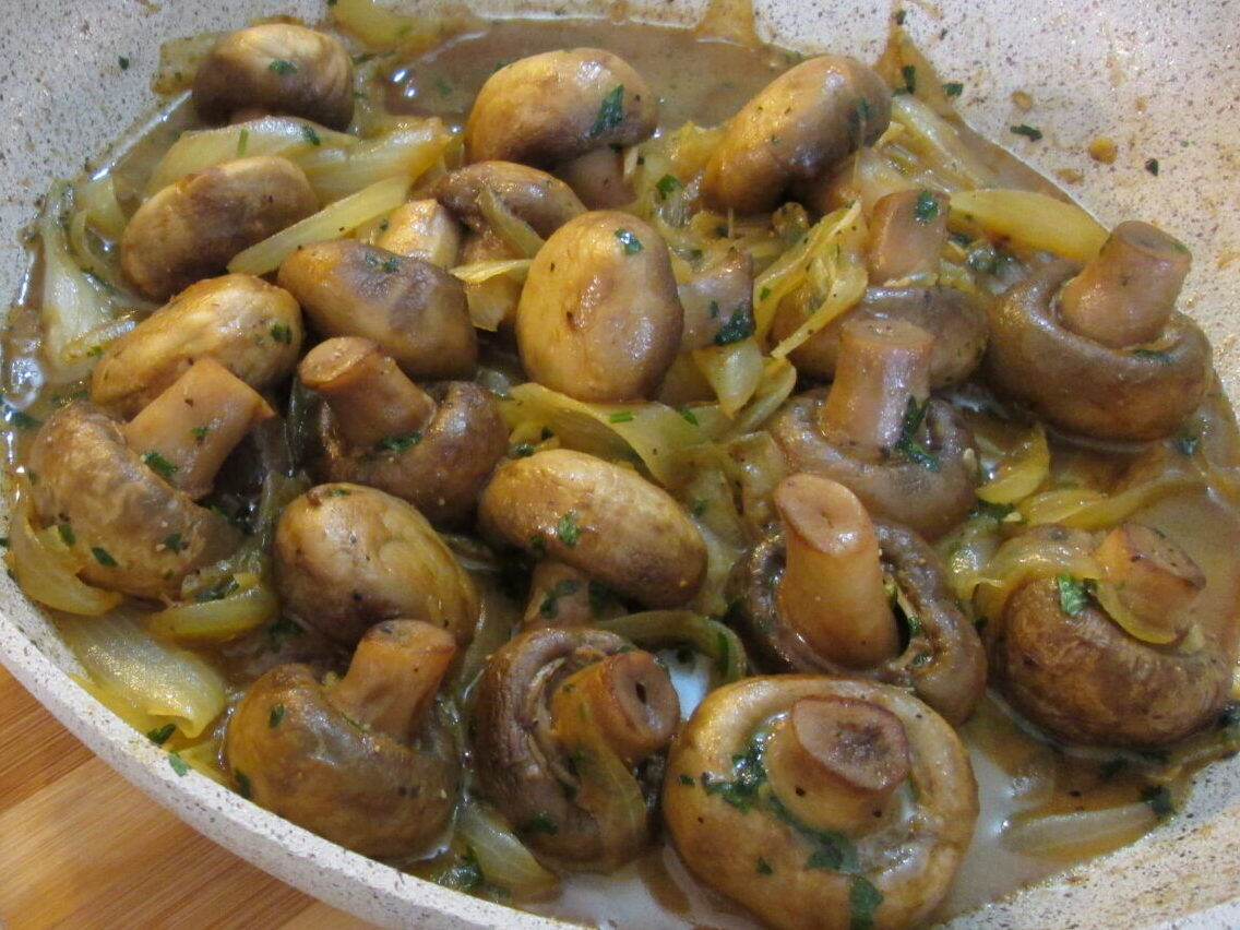 Sweet caramelized onions with garlic mushrooms and butter broth sauce.